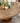 Sarah - 60" pedestal table - Rum - 5347